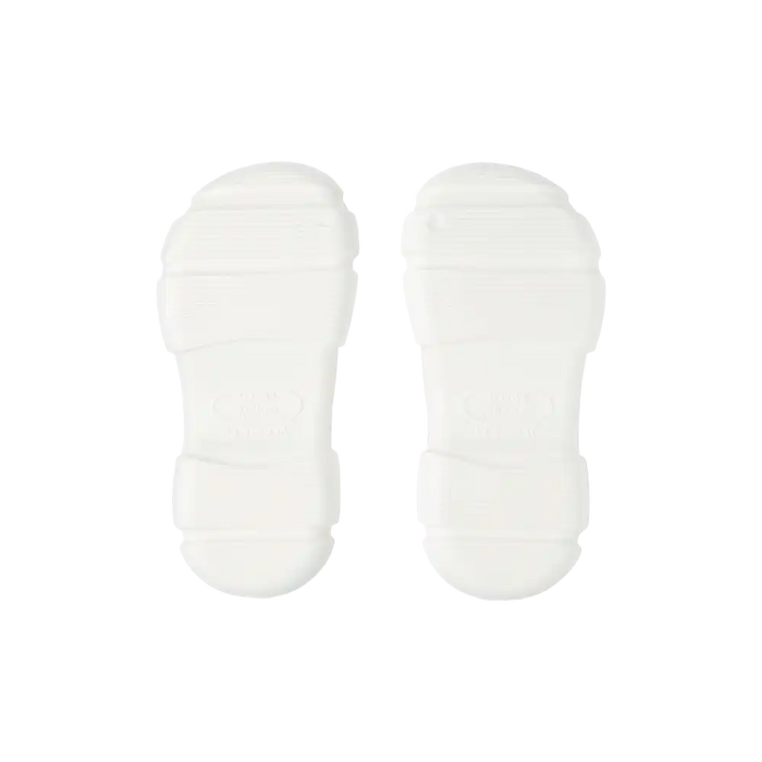 Pair of white air clog shoes soles isolated on black background lightweight cushioned non slip