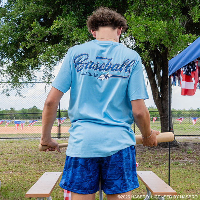 Adult model wearing blue shorts with “G.I. Joe Star” design