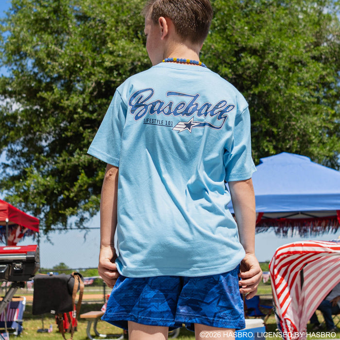 Youth model wearing blue youth shorts with βG.I. Joe Starβ design