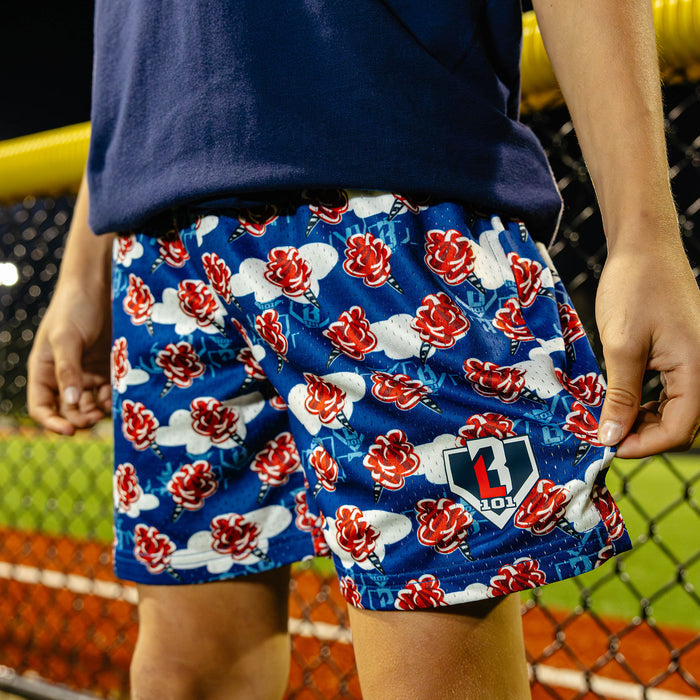 Youth model wearing red, white & blue Home Run Sugar USA youth shorts