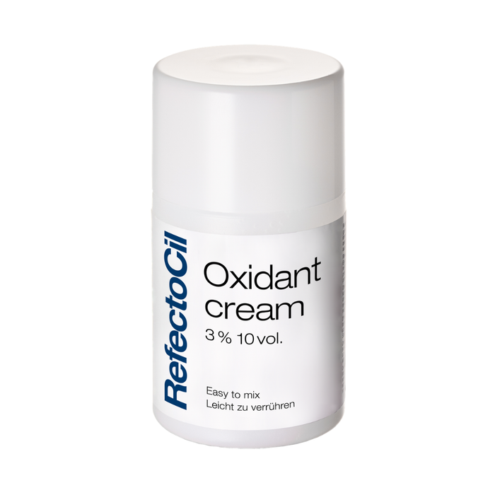 F003F Refectocil Eyelash Tint Oxidant Cream | A white cylindrical bottle of RefectoCil Oxidant cream 3% 10vol. on a plain white background.