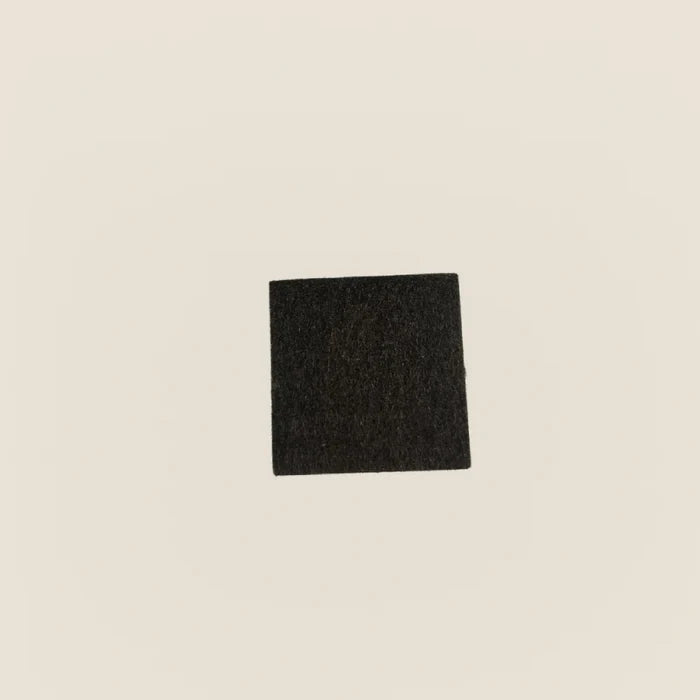 Single black felt pad for Gratz Pilates equipment floor protection.