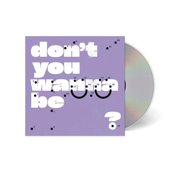 A CD partially out of its lavender case, displaying large white text dont you wanna be? with black dots and numbers forming a dot-to-dot smiley faceโSuper Whatevrโs artwork inviting you to feel better.