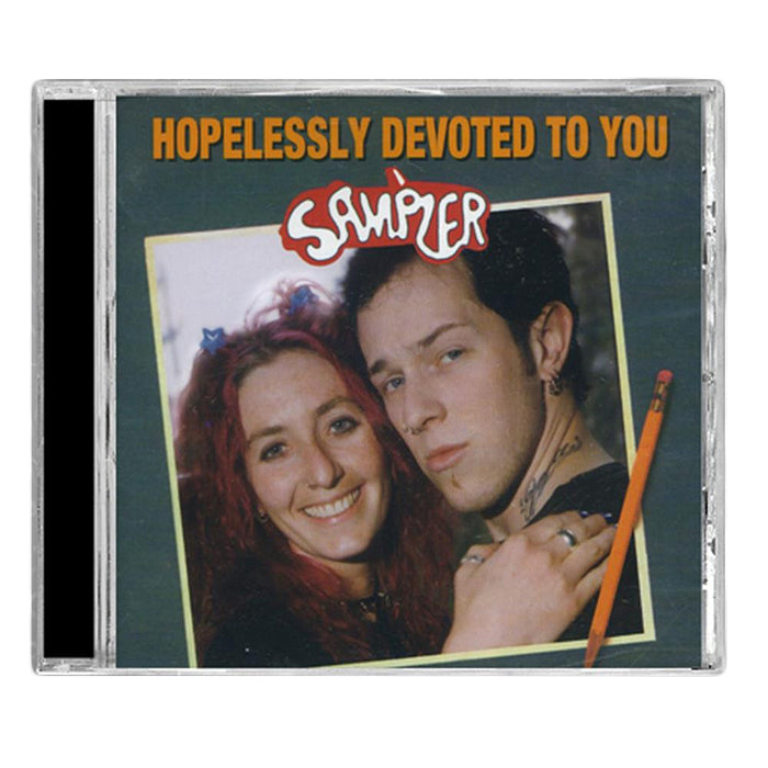 CD cover with two people close together, one smiling, one neutral. βHopelessly Devoted To Youβ is at the top, and Sampler in playful scriptβan iconic Punk Compilation from Various Artists by Hopeless Records.