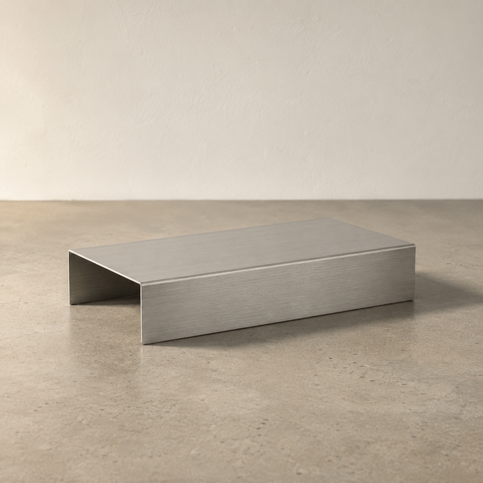 Wide rectangular stainless steel display riser with two folded legs.