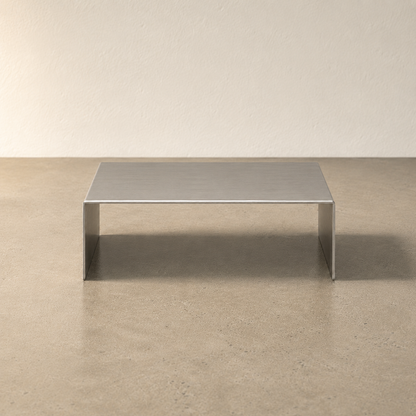 Front view of a wide stainless steel display riser.