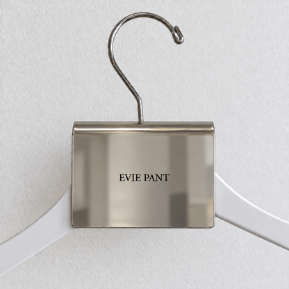 Mirrored stainless steel hanger sign clip with Evie Pant lettering.