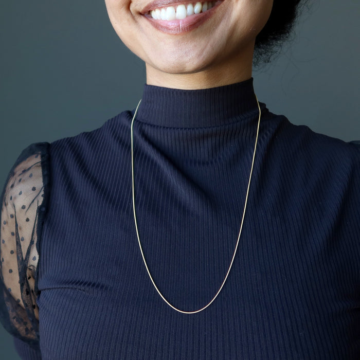 sheila of satin crystals wearing Adjustable Snake 14 Karat Gold on Sterling Silver chain