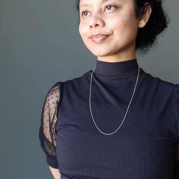 sheila of satin crystals wearing Adjustable Snake 14 Karat Gold on Sterling Silver chain