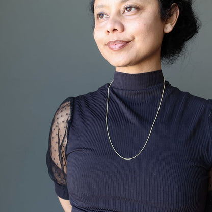 sheila of satin crystals wearing Adjustable Snake 14 Karat Gold on Sterling Silver chain