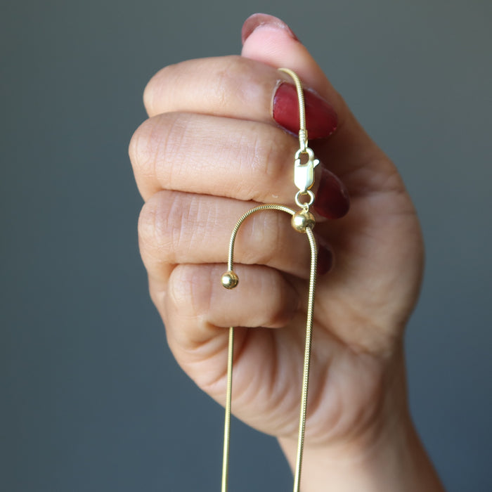showing a sliding knot of Adjustable Snake 14 Karat Gold on Sterling Silver chain