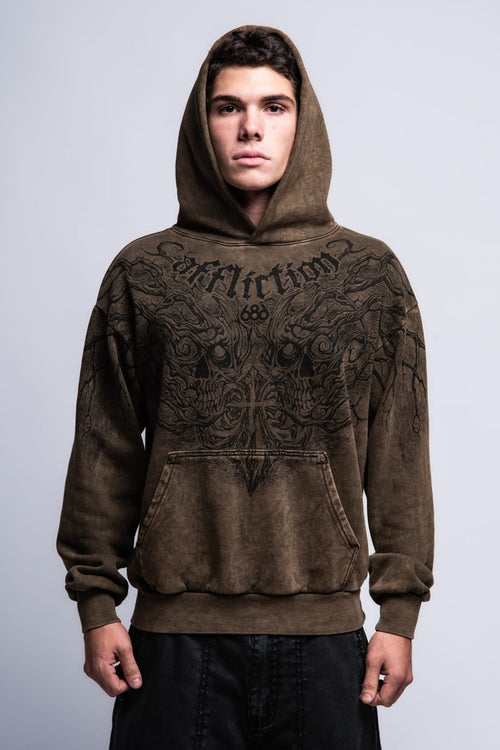 A young man faces forward against a plain light-gray background, wearing the 686 Affliction Natural Rot Pullover Hoody by 686, a brown men‚Äôs sweatshirt featuring black intricate designs and "Affliction" on the chest.