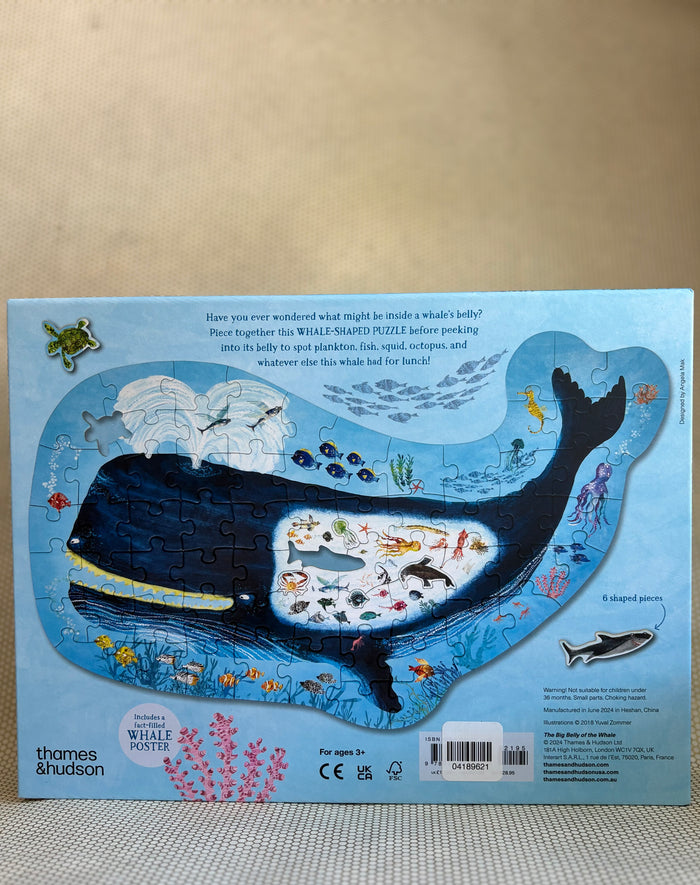 Whale-shaped puzzle with illustrations on a beige background