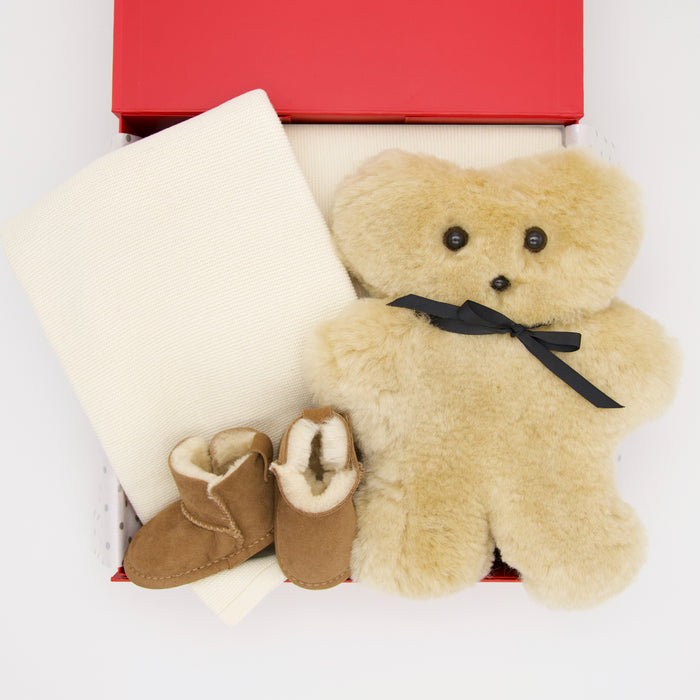 All gifts are beautifully presented in our signature chic red memory box, including:

Tambo Teddy - Bickie Bear
Branberry Tiny Garter Knit Blanker - Ivory
Emu Sheepskin Booties - Chestnut

Price: 290