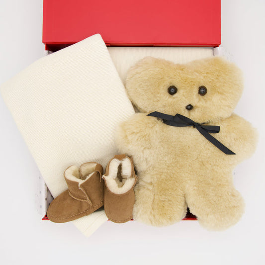 All gifts are beautifully presented in our signature chic red memory box, including:

Tambo Teddy - Bickie Bear
Branberry Tiny Garter Knit Blanker - Ivory
Emu Sheepskin Booties - Chestnut

Price: 290