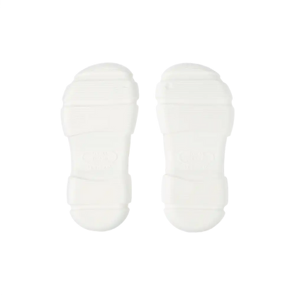 Pair of white air clog shoes soles isolated on black background lightweight cushioned non slip