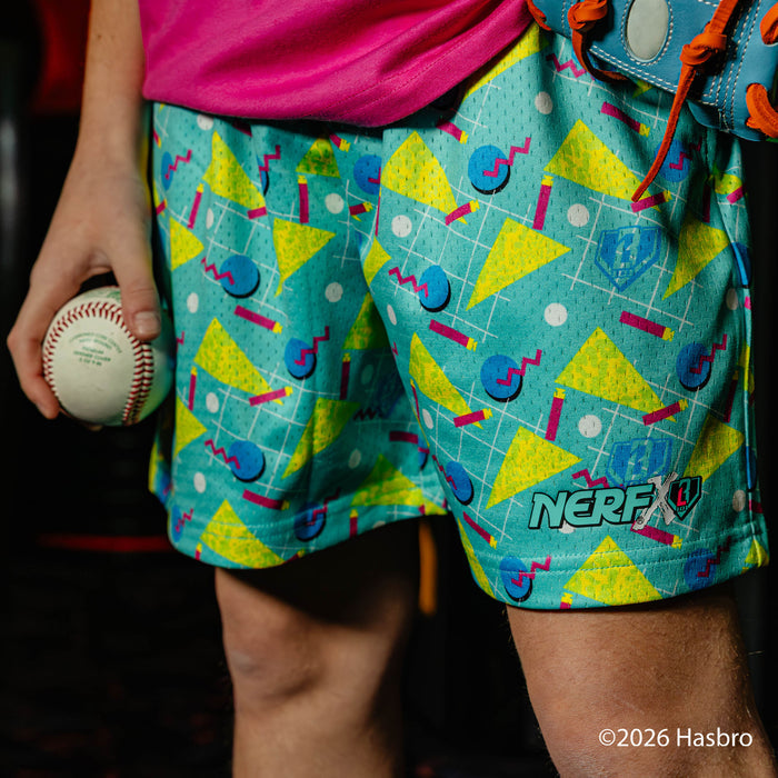 Person wearing colorful shorts with geometric patterns and a baseball, with 'NERF X BL101' branding.