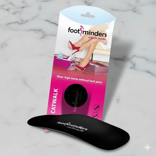 Footminders Catwalk insole packaging with a black insole on a marble background