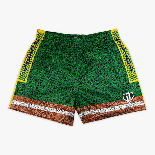 Front flat lay of BL101 baseball field mesh shorts featuring a grass-texture body, dirt and chalk line hem, yellow diamond-pattern side panels with BL101 text, and BL101 logo on a white background.