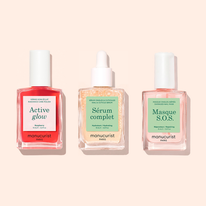 Three manicure products in glass dropper bottles are displayed side by side on a beige background: Basic Routine - Sensitive Nails from Manucurist, offering essential nail care solutions designed specifically for sensitive nails.