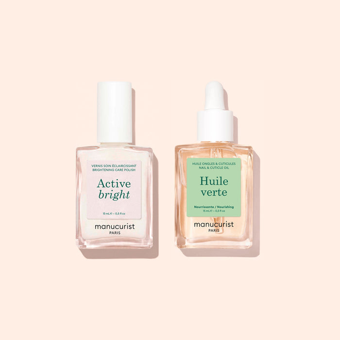 Two square bottles from Manucurist’s Basic Routine - Yellow Nails set—one labeled Active Bright nail polish for nail brightening and the other, Huile Verte nourishing cuticle oil with a dropper—are displayed on a soft beige background, making them ideal additions to any nail care routine.