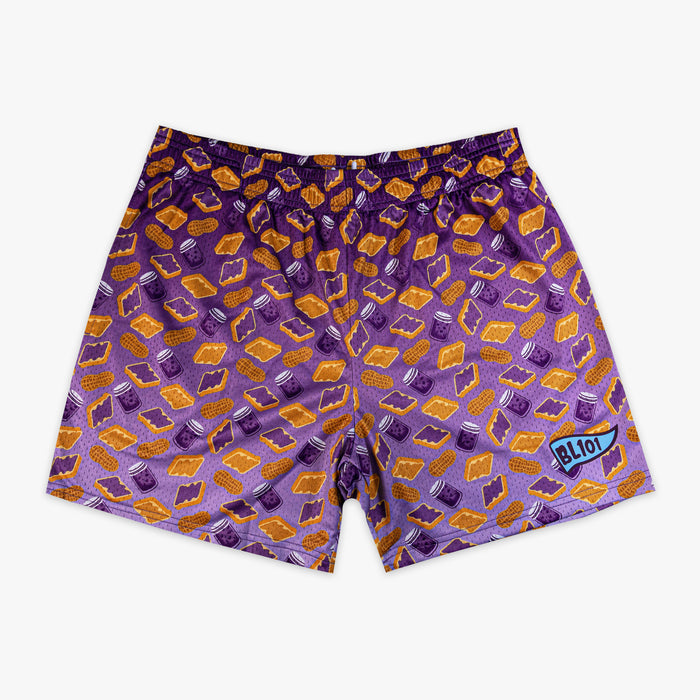 Flat lay of BL101 purple mesh shorts with an all-over peanut butter sandwich, peanut, and jelly jar print on a white background.