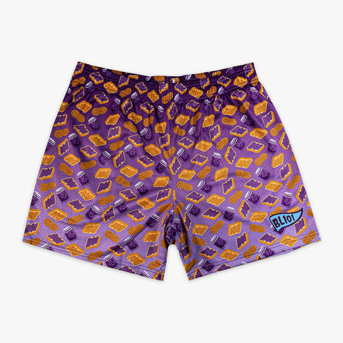 Flat lay of BL101 purple mesh shorts with an all-over peanut butter sandwich, peanut, and jelly jar print on a white background.