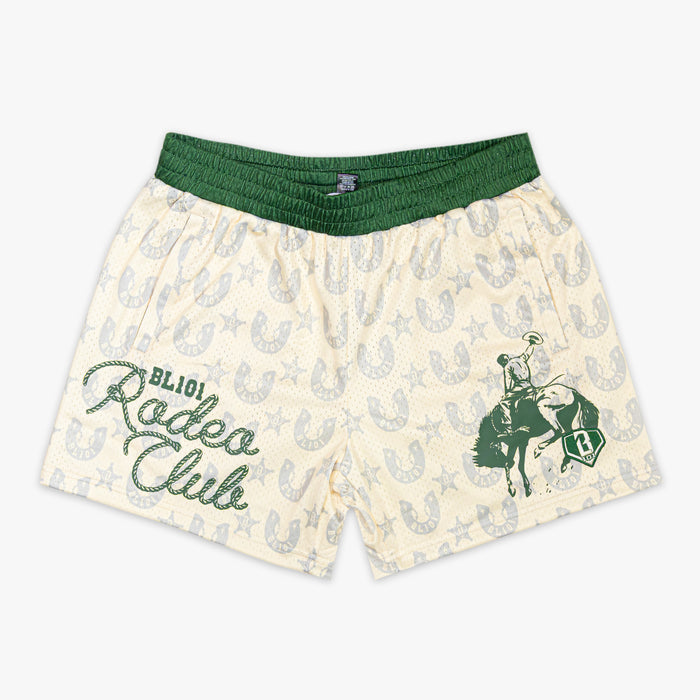 Beige shorts with green horse and rider design and 'Rodeo Club' text on a white background