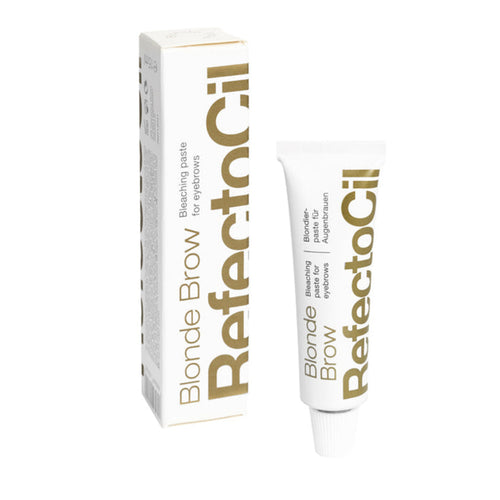 A tube of RefectoCil Blonde Brow bleaching paste for eyebrows, with the product packaging behind it.