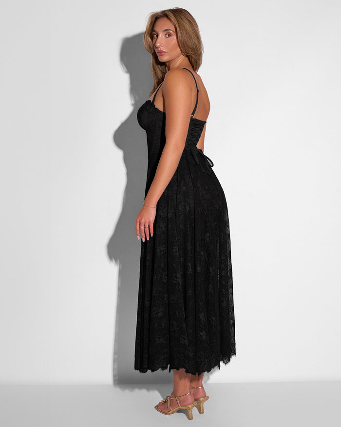 Model in Bombshell Midi Dress - Lace Black three quarter back view