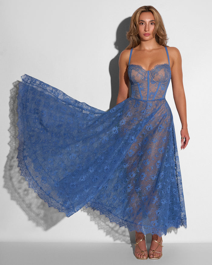 Model posing in Bombshell Midi Dress - Lace Steel Blue/Tawny with the skirt flared out