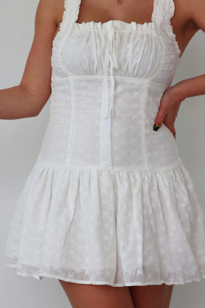 girl wearing short white dress