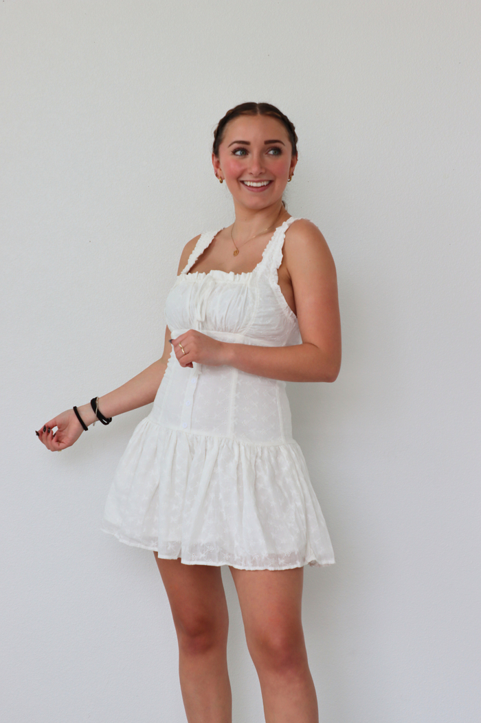 girl wearing short white dress