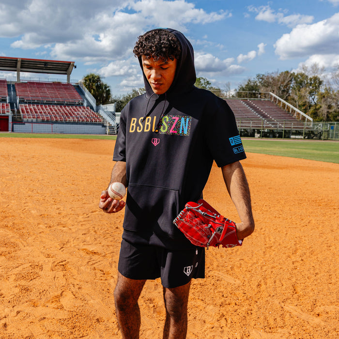 Youth model wearing black and midnight sundae BSBL-SZN youth short sleeve hoodie