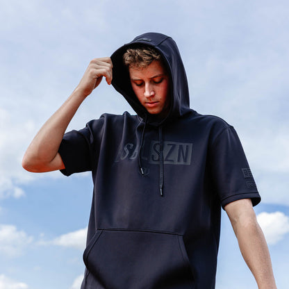 Youth model wearing black BSBL-SZN Blackout youth short sleeve hoodie