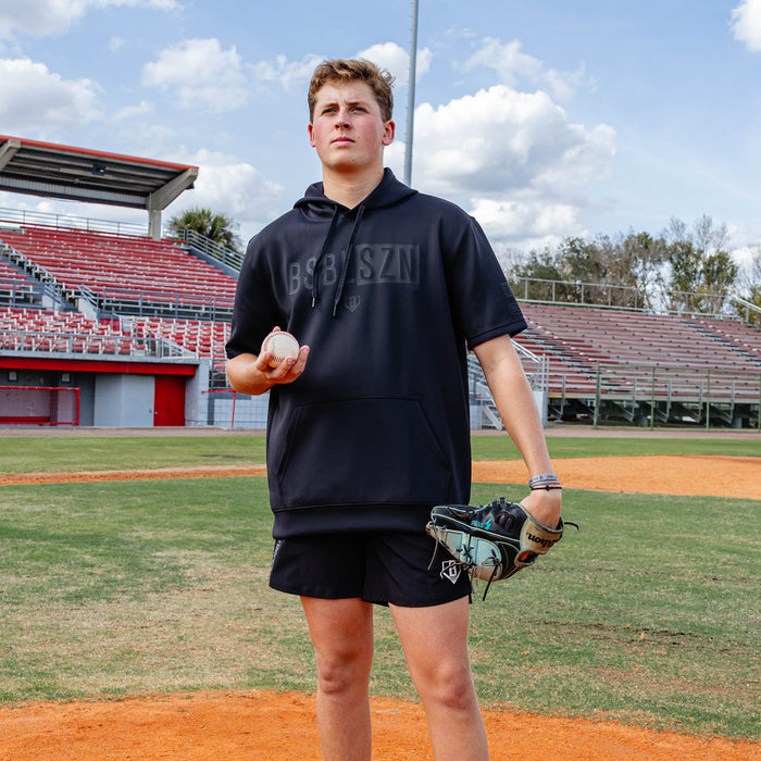 Youth model wearing black BSBL-SZN Blackout youth short sleeve hoodie