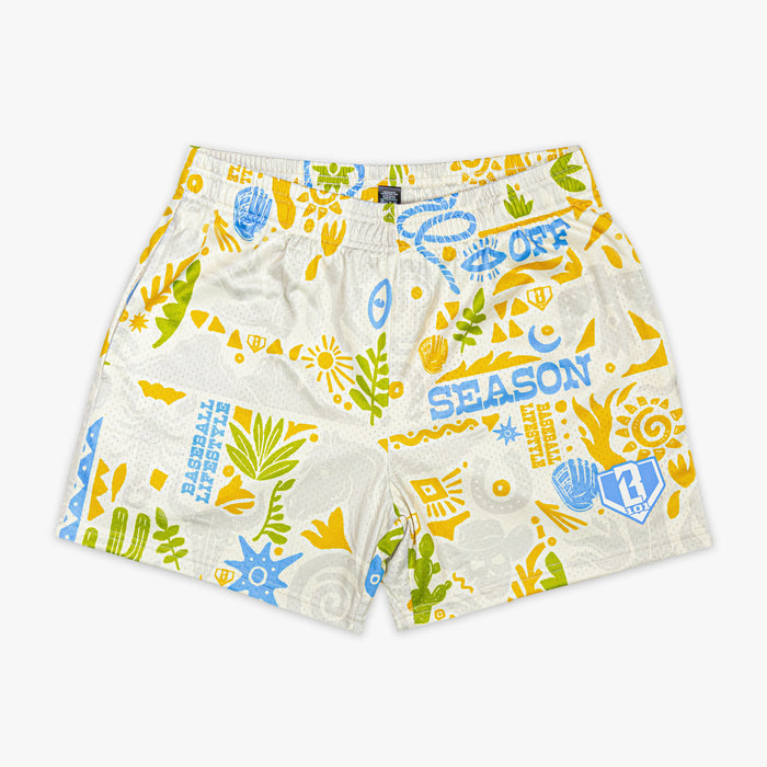 Colorful desert patterned shorts on a white background
