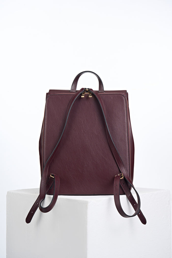 Back view of Casey Black Cherry faux leather Laptop Backpack showing the zip up back laptop pocket and two shoulder straps