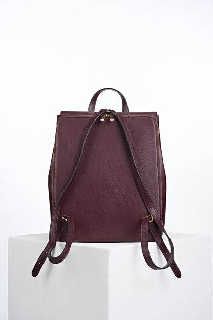 Back view of Casey Black Cherry faux leather Laptop Backpack showing the zip up back laptop pocket and two shoulder straps
