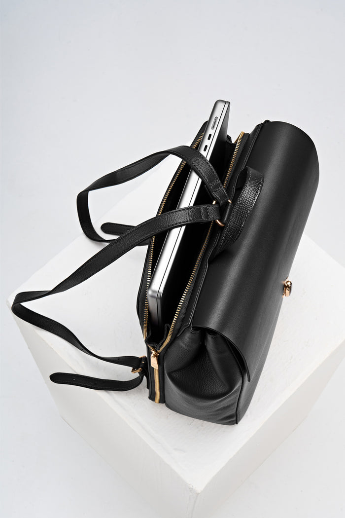 Overead view of Casey Black faux leather Laptop Backpack showing the back laptop pocket, shoulder straps and reptile printed grab handle