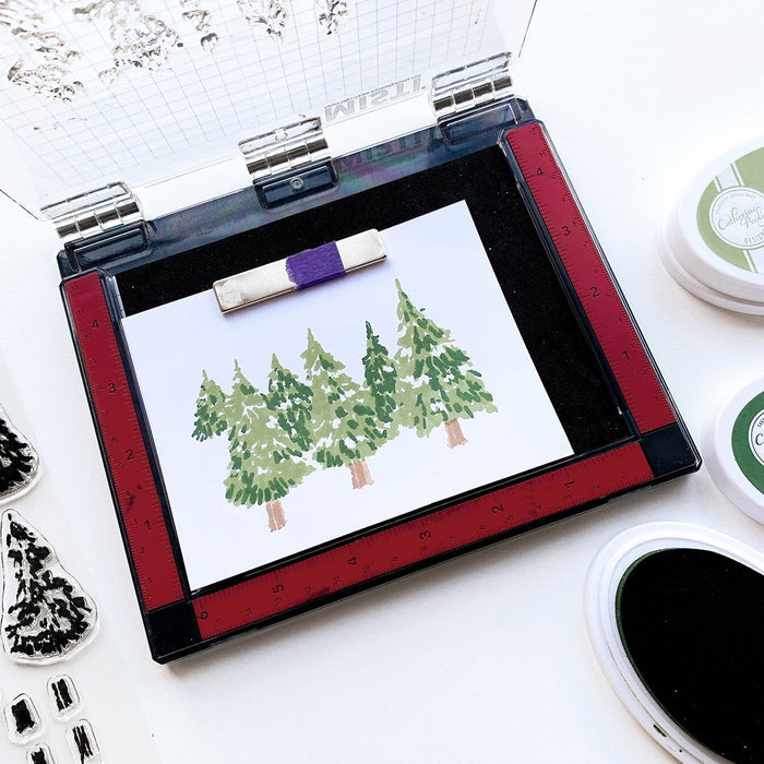 Catherine Pooler - Stamps - Evergreen Woods. Create your own Evergreen Woods with our 6x8 layering stamp set and coordinating Evergreen Woods Dies. This set contains multi-step stamps to "build" a forest of pine trees or an individual tree. The addition of the North Star stamp will bring added warmth to your winter scene or even make a nice holiday tree topper. Available at Embellish Away located in Bowmanville Ontario Canada.