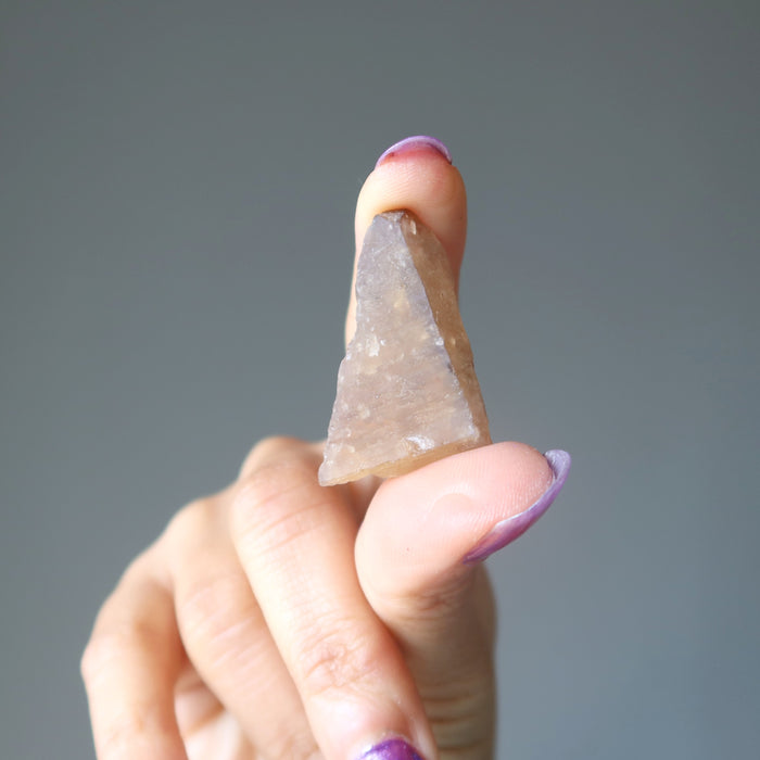 hand holding untreated citrine