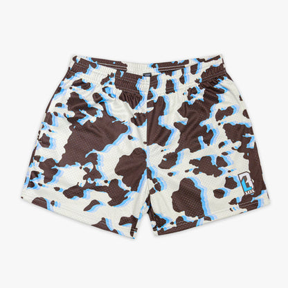 Cow print shorts with brown, black, and blue color way on a white background