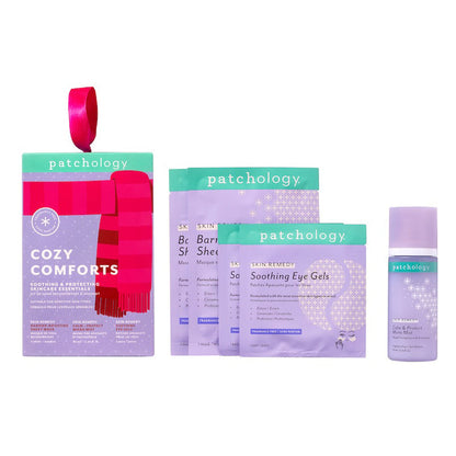 Cozy Comforts kit box with ribbon hanger shown with two barrier-boosting sheet masks, two soothing eye gel pouches, and a calm and protect micro mist