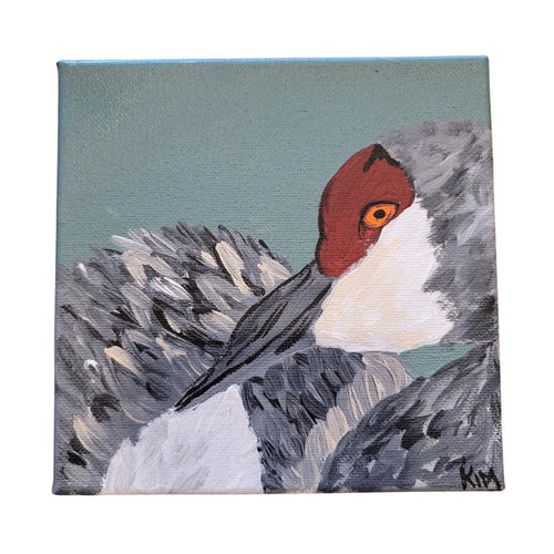 Painting of a bird with a red head and gray body on a textured background