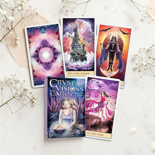 Crystal Visions Tarot cards on a white surface with decorative elements