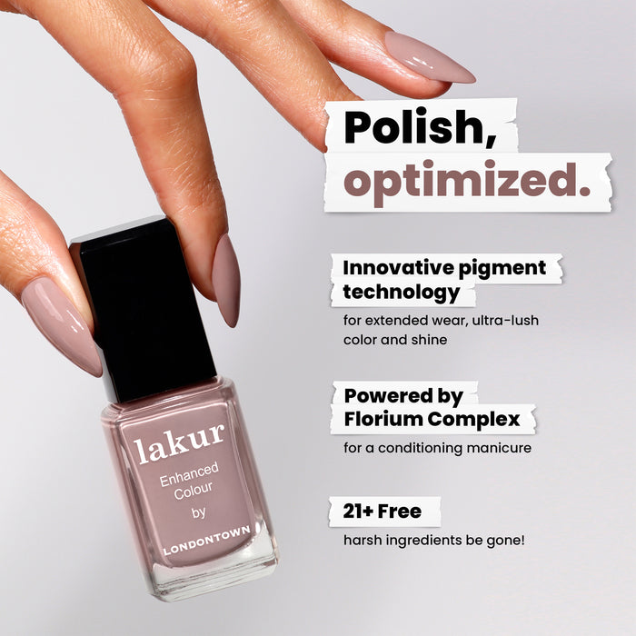 A hand holds a bottle of LONDONTOWN's Do Not Disturb nail polish. The rich mauve hue makes a bold statement, with innovative pigment technology, Florium Complex, and a 21+ free formulation ensuring exquisite performance.