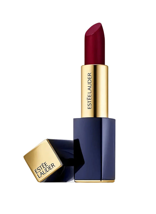 Sheer matte lipstick in dark red shade with gold and navy tube, cap beside base