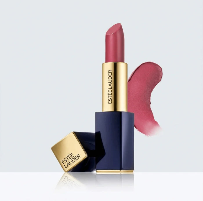 Pink sculpting lipstick with gold and navy case and lipstick swatch on white background