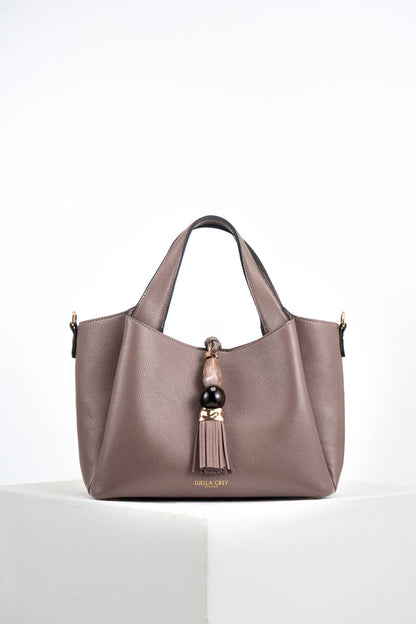 Front of Etta Fawn faux leather Small Tote with resin and molten gold Signature Mayfair Tassel charm closure